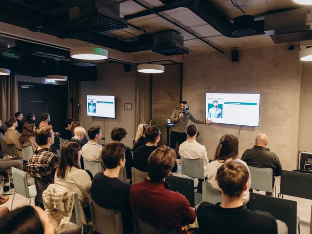 Mo presenting to a full room at TechChill in Riga.